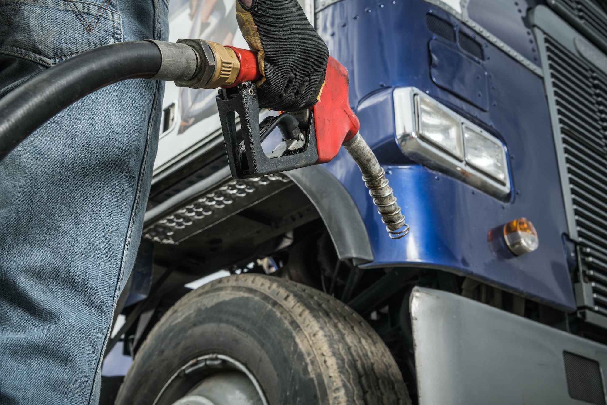 Trucker in Front of His Truck Preparing For Diesel Fueling